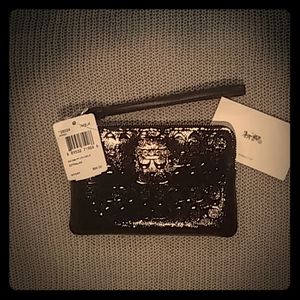 Black leather signature print wristlet